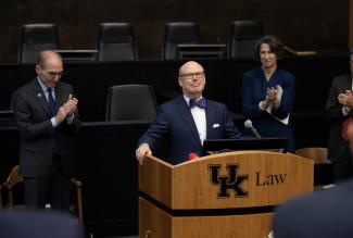Rosenberg at lectern