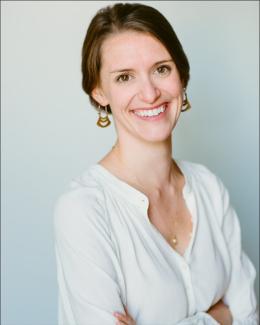 Picture of a professional woman wearing white clothing.