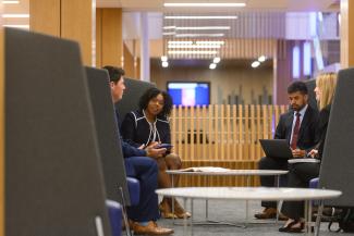 Students meeting in common area of law building. 
