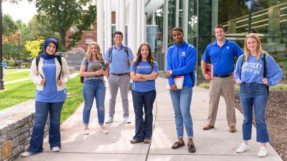 law students standing outside of the law building, wearing UK attire